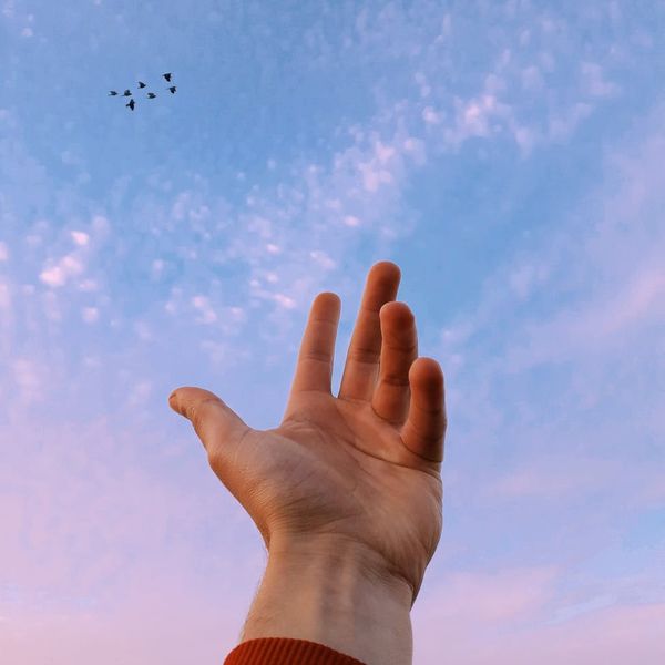 Silhouette of a person feeling energized and balanced against a calm background.